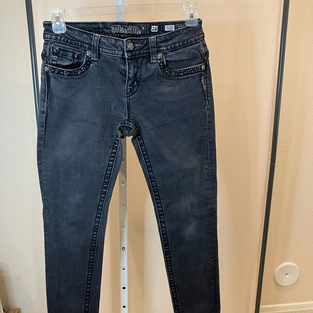 Miss Me mid rise skinny jeans in light black with dark black trim and bling.